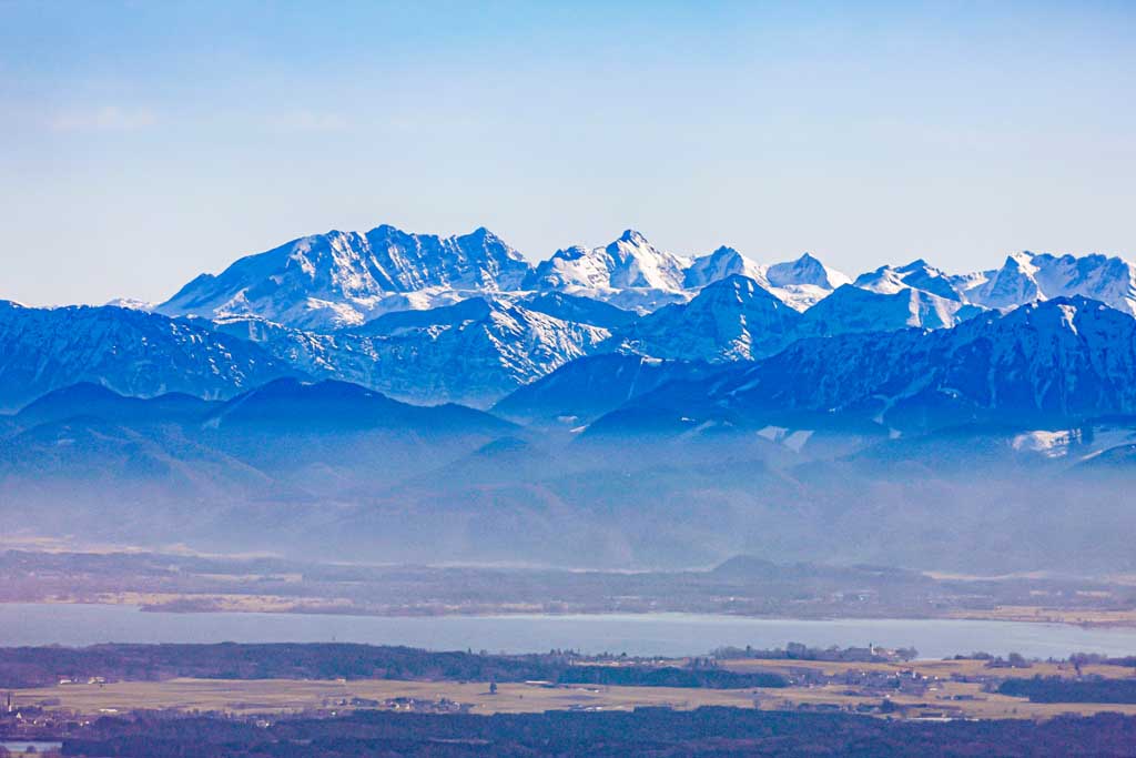 Chiemsee in front of the Alps, shrouded in haze 