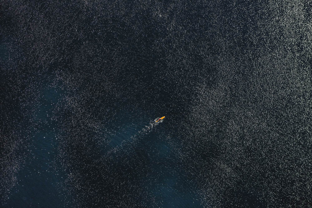 Bodyboarder in backlight