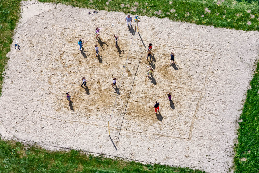 School volleyball lesson on the sand court