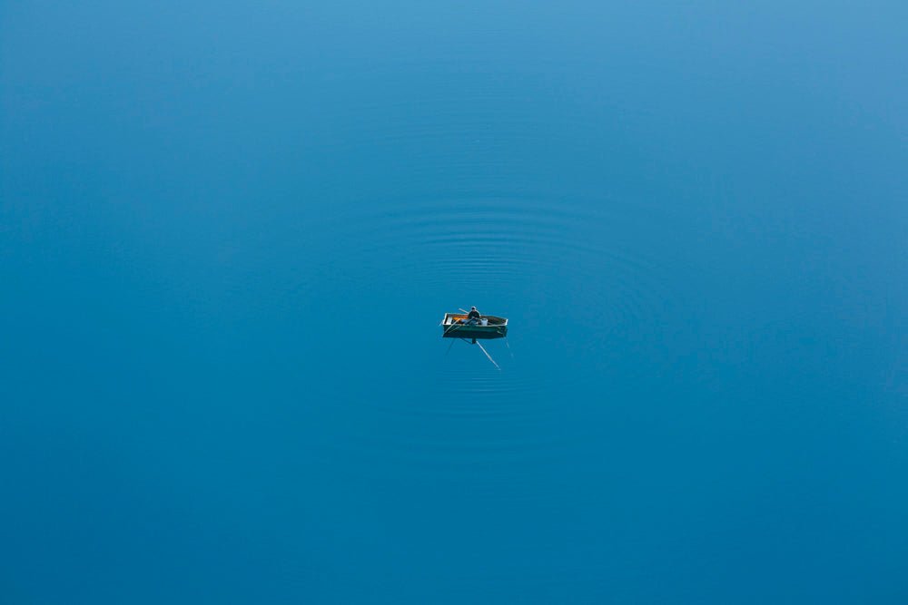 Angler im Ruderboot