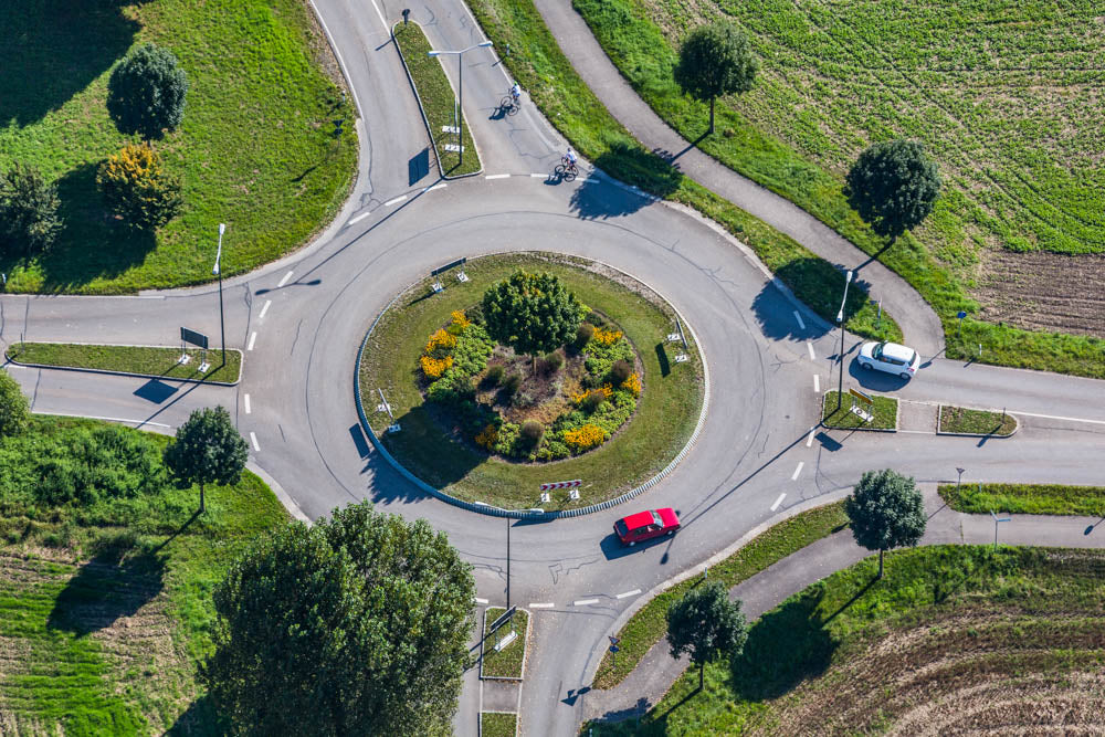 Red car in the roundabout