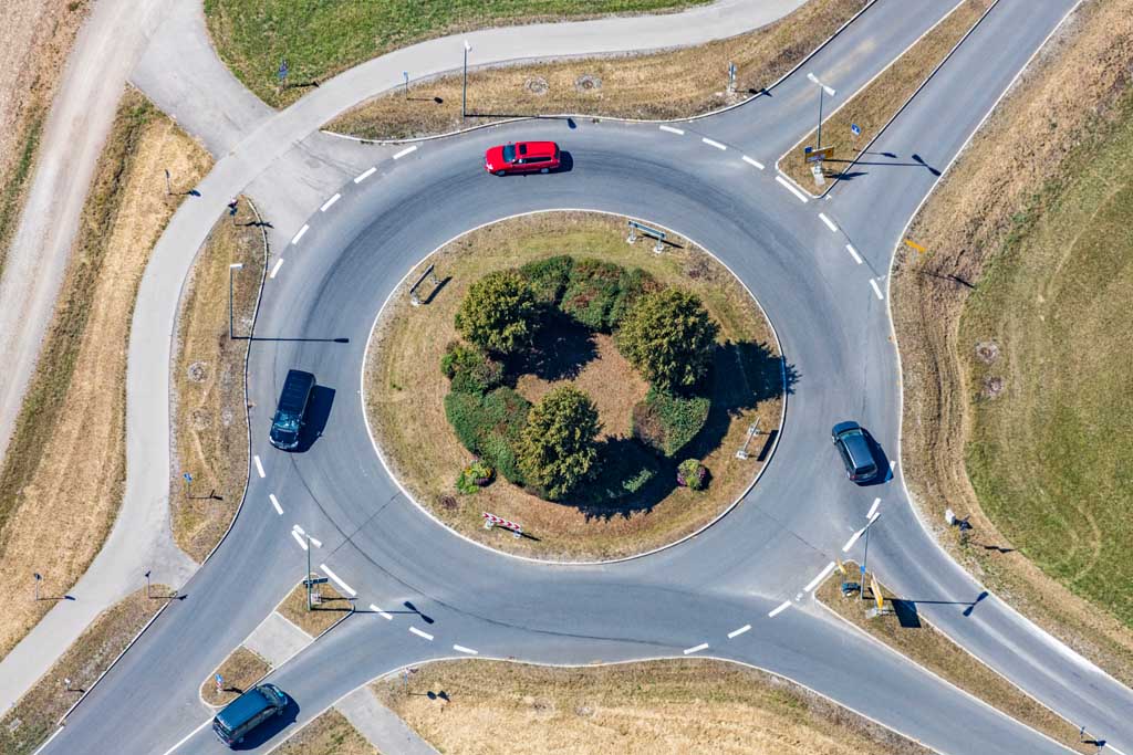 Red car in the roundabout
