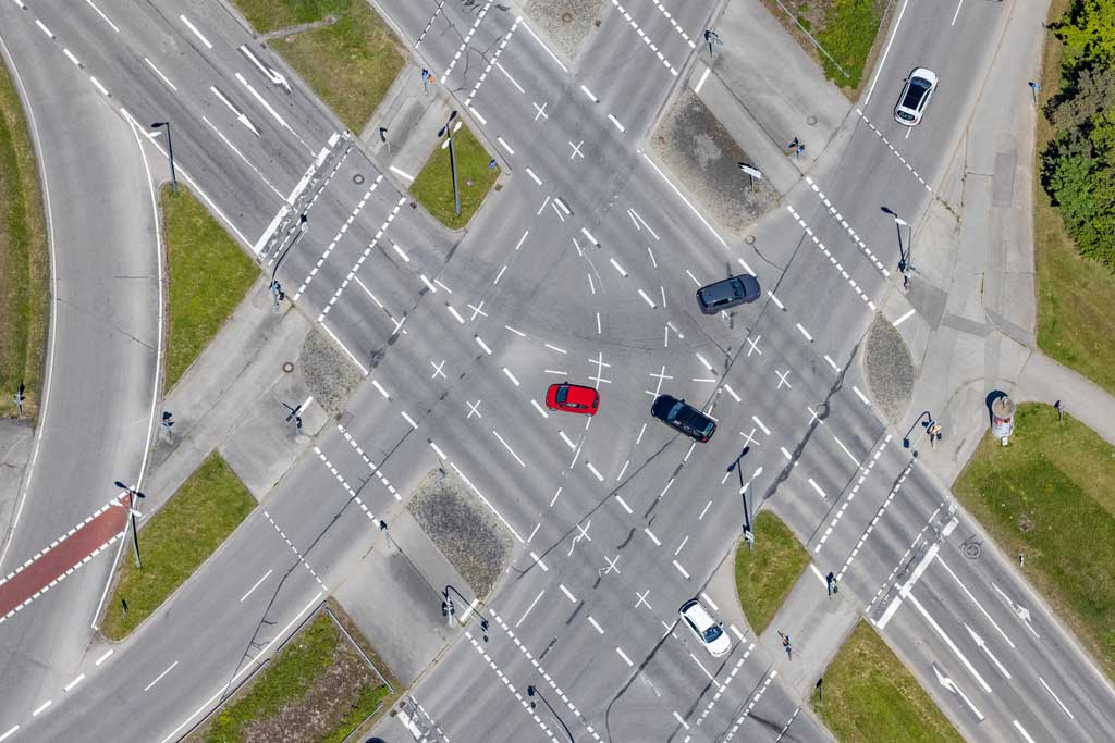 Red car at an intersection in Munich-Neuperlach 