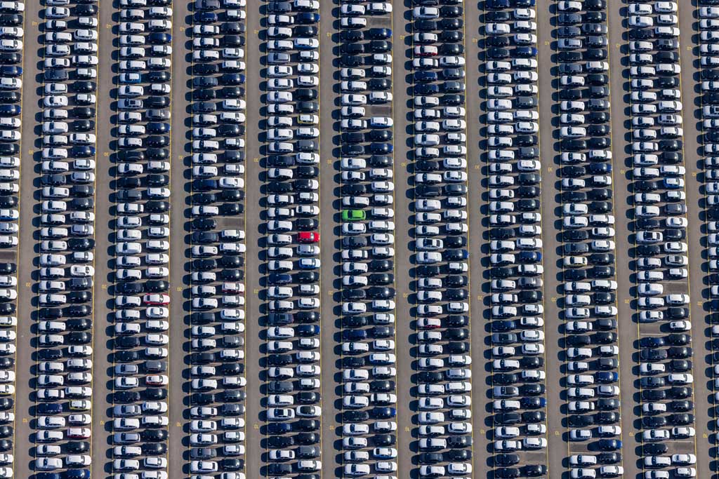 Two colored vehicles in the car terminal test field 