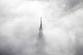 The church tower of St. Martin's Church is shrouded in fog. 