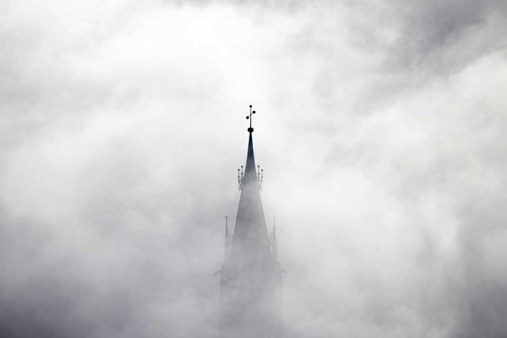 The church tower of St. Martin's Church is shrouded in fog. 