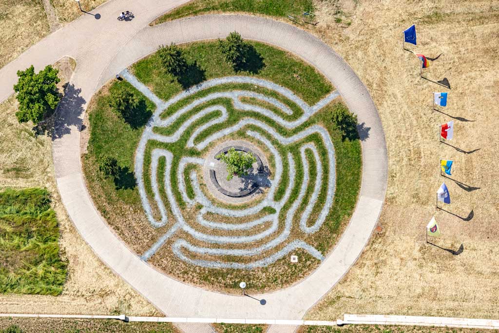 Circular labyrinth with row of flags 