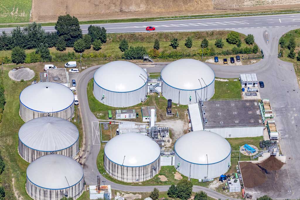 Red car over biogas plant