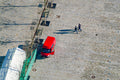 Two pedestrians and a red van